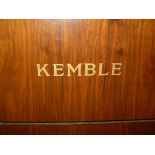 A Kemble walnut cased upright mini piano with iron framed overstrung movement