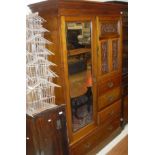 A Victorian walnut compactum with ogee moulded pediment with single mirrored door to the left and