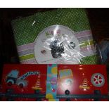 A box of assorted children's bedroom accessories loosely based on a vehicle theme,