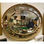 An oval multi-plate wall mirror,