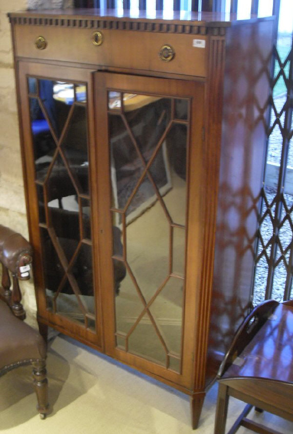 An Edwardian mahogany side cabinet with a single drawer,