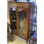 An Edwardian mahogany side cabinet with a single drawer,