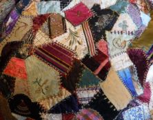 A 19th Century patchwork quilt with embroidered decoration to include floral sprays, insects,