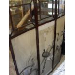 A circa 1900 mahogany framed three fold screen with glazed upper section and lower section set with