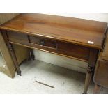 A 20th Century mahogany single drawer side table on four turned supports,
