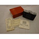 A Zeiss Ikon Nettar roller film camera with box and instruction leaflets