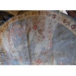 A crewel work rug / panel of circular form,