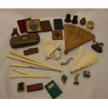 A box containing assorted sundry items to include ivory glove stretchers, fans,