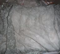 A box containing assorted vintage lace and silk undergarments to include bed jackets,