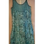 A circa 1920's full length evening dress in turquoise chiffon with hand-sewn bead decoration