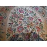 A French crewel work type rug, the central panel decorated with floral sprays in pink,