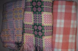Two Welsh blankets of pink and cream colouring,