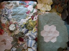 A box containing an un-finished mid 20th Century grandmother's garden patchwork quilt,