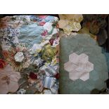 A box containing an un-finished mid 20th Century grandmother's garden patchwork quilt,