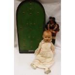 An early to mid 20th Century composition doll and a doll depicting a Native American with child and