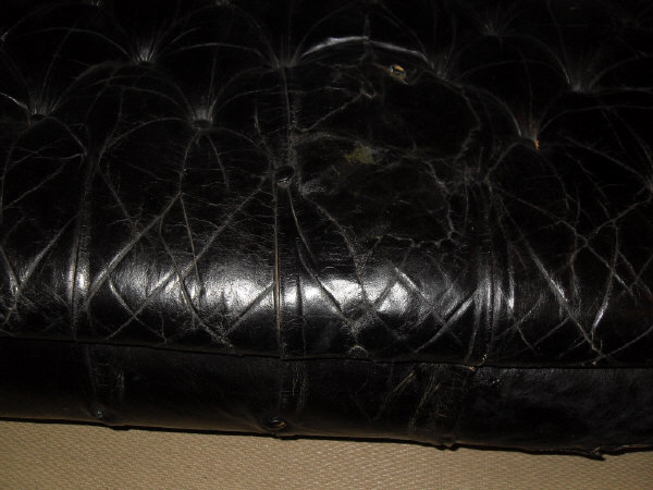 A late Victorian buttoned leather upholstered Chesterfield sofa on turned legs to brass caps and - Image 9 of 12