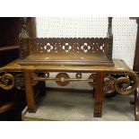 A Chinese rosewood low coffee/opium table, an oak book shelf carved in a gothic manner,