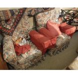 A pair of 1930's upholstered armchairs with loose covers