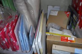 A box containing various Minene storage boxes, children's rugs,