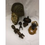 A collection of various tribal items comprising one Baoule mask, Igbo mask, Tschokwe mask,