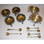 A set of Victorian silver cauldron salts with embossed floral decoration,