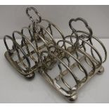 A pair of plated four section toast racks,