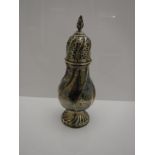 A late Victorian silver sugar caster of baluster wrythen form with pierced lid,