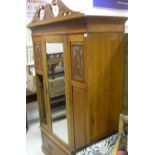 A yew wood revolving octagonal booktable and mahogany D-shaped side table on three turned supports,