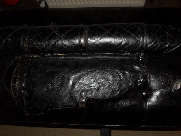 A late Victorian buttoned leather upholstered Chesterfield sofa on turned legs to brass caps and - Image 3 of 12