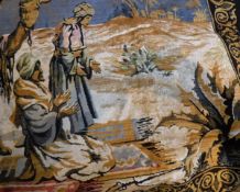 A modern wall hanging depicting camels and tribal men in a desert landscape