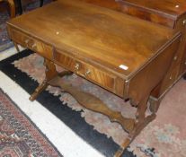A Bevan Funell Reprodux mahogany and cross-banded sofa table in the Regency style