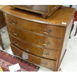 A 20th Century walnut bow fronted chest of four drawers,