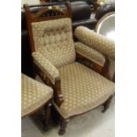 A late Victorian walnut salon suite in the aesthetic taste comprising chaise longue,
