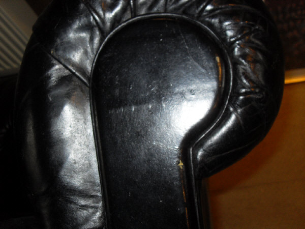 A late Victorian buttoned leather upholstered Chesterfield sofa on turned legs to brass caps and - Image 5 of 12