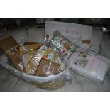 An Izzi Wotnot moses basket, an Ella & Otto playmat, various gro bag sleeping bags, a bedding bale,