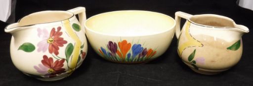 A Clarice Cliff "Crocus" pattern fruit bowl, a "Willow" pattern cheese dish, two Arthur Wood jugs,