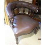 A Victorian Captains chair with buttoned upholstered back rail above turned spindles,