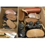 Two boxes containing assorted binoculars / field glasses to include a pair of Eubeeco Navigator 9 x