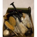 A box containing assorted dressing table brushes,