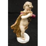 A 19th Century Meissen figure of a skating putto in fur wrap emblematic of Winter,
