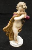 A 19th Century Meissen figure of a skating putto in fur wrap emblematic of Winter,