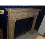 A pine fire surround with applied moulded swag and foliate decoration CONDITION REPORTS