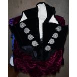 A collection of clothing to include a velvet bodice with filigree work decoration and white