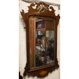 A 19th Century mahogany and parcel gilt hanging mirror with Hoho bird to the top and conch shell