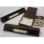 An early to mid 20th Century bone and bamboo Mahjong set,