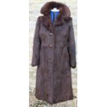 A dark brown squirrel fur full length coat,