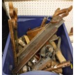 A box of various wood-working and other tools to include planes, blow torch, saws,