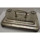 A late Victorian silver inkwell stand with engraved foliate decoration and inscribed "From the