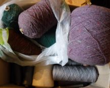 A box and a bag containing various yarns