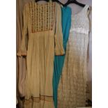 A collection of seventeen vintage dresses, tops, skirt suits, etc,